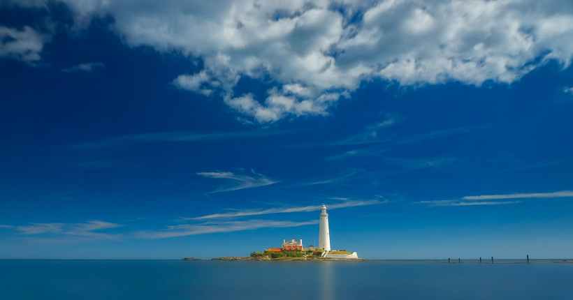 A lighthouse on a small island.